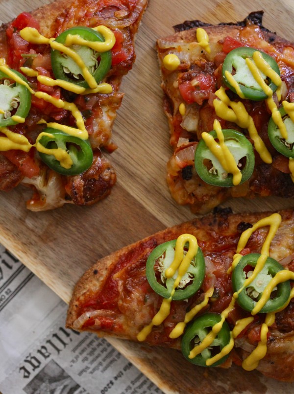 chicken andouille naan pizza with pico de gallo and jalapenos