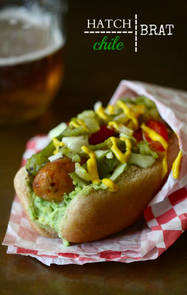 Andouille chicken sausage brats loaded with hatch chiles and avocado crema.