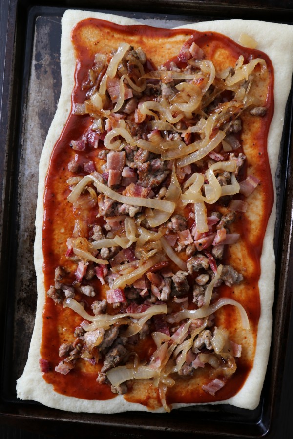 caramelized onion, sausage, and barbecue pizza with ranch dressing