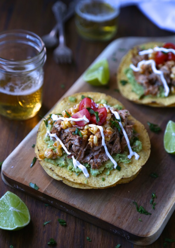 Baby back rib tostadas topped with with corn relish and crema.