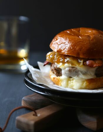 Bacon and Brie Burger with Spicy Peach Caramelized Onions