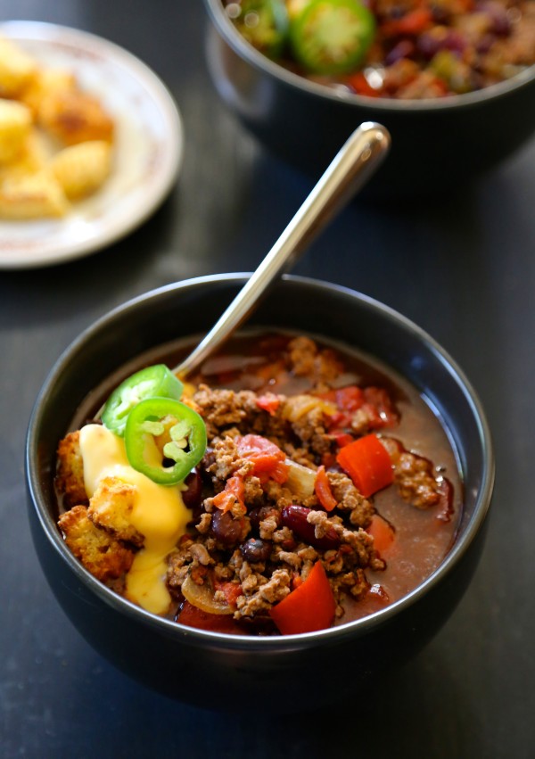 slow cooker tijuana chili with jalapeno cornbread croutons & queso