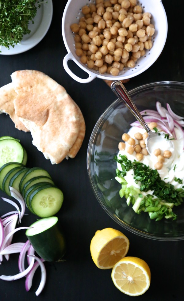 chicken and chickpea salad pita sandwiches with broccoli sprouts