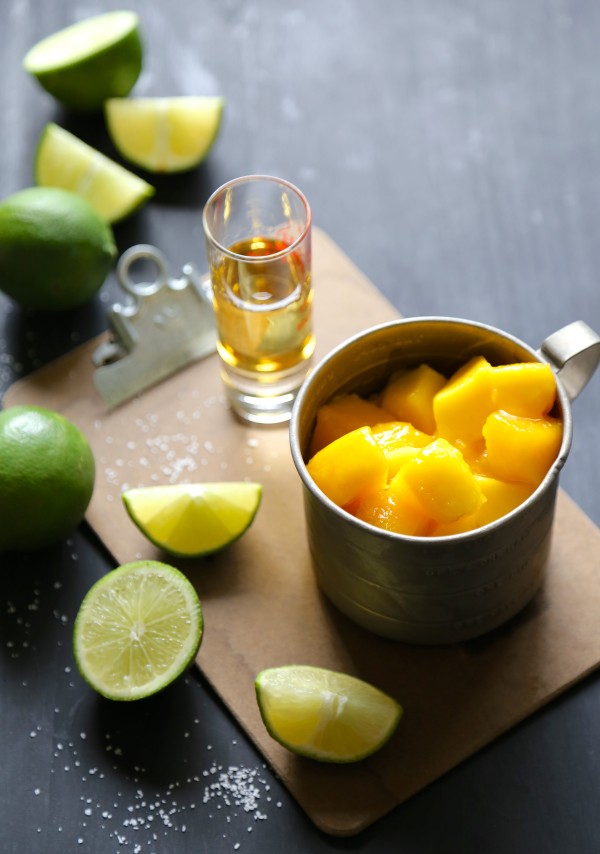 Mango cubes in a measuring cup.