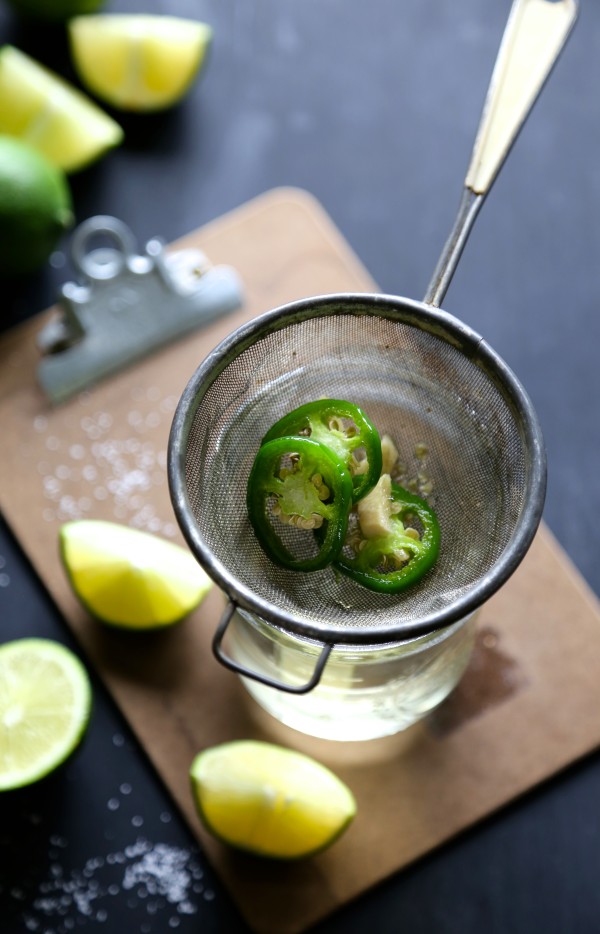 Jalapenos and ginger in a strainer.