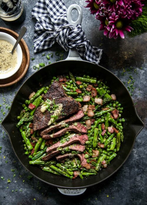 one skillet coffee rubbed steak with bacon & spring vegetables