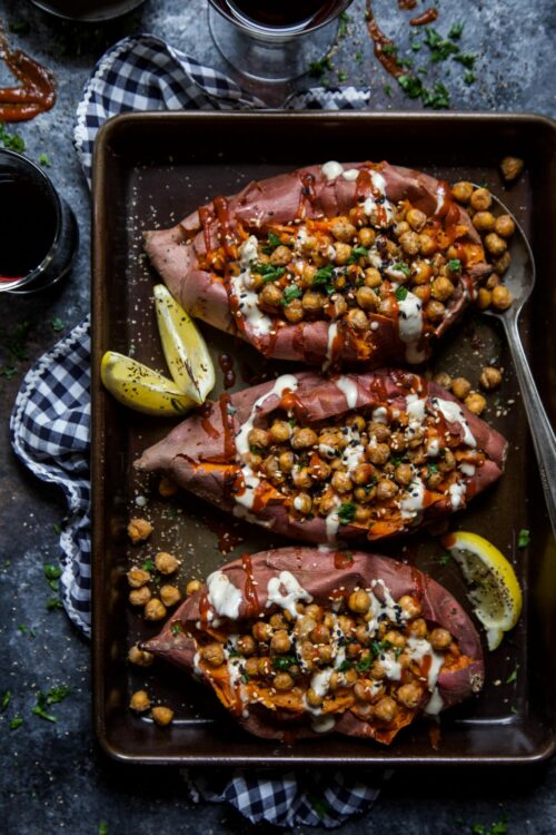 toasted sesame chickpea stuffed sweet potatoes with ginger tahini