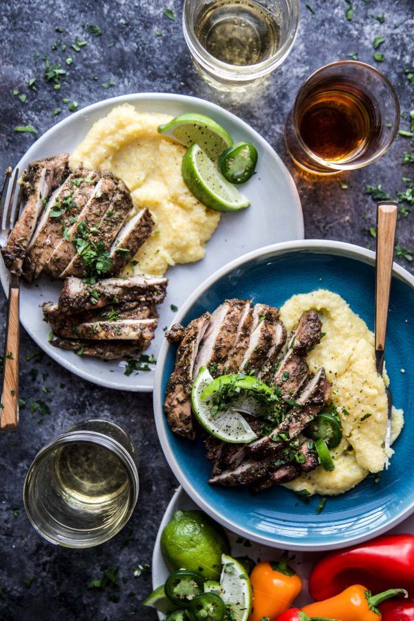 jerk chicken with polenta on a plate