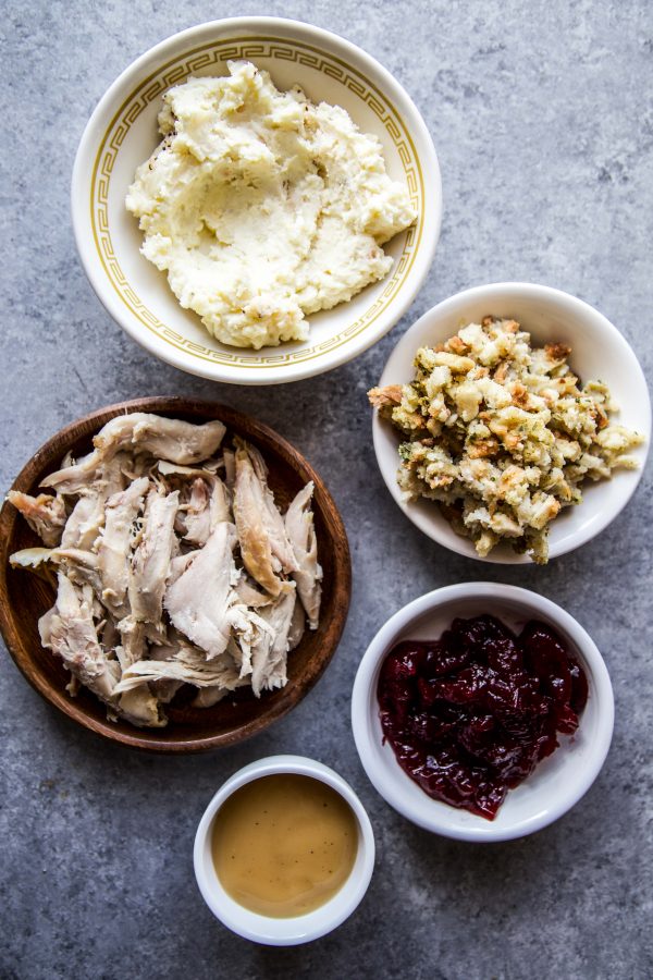 A bowl of food on a plate, with Thanksgiving Leftovers