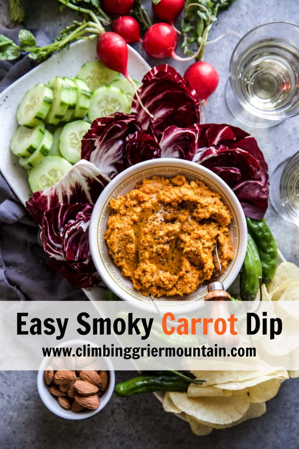 carrot dip in bowl with assorted food