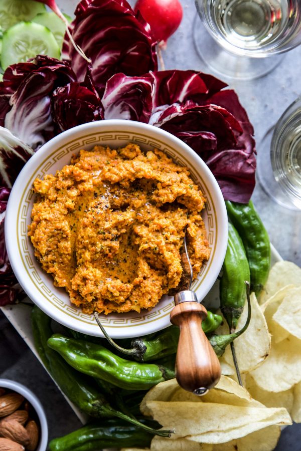 carrot dip in bowl with assorted food