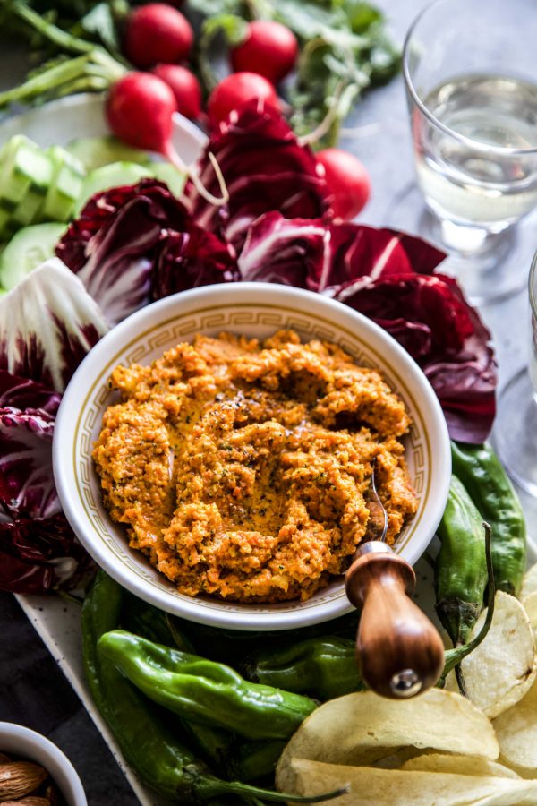 carrot dip in bowl with assorted food