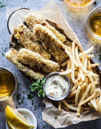 Baked Za'atar Fish Sticks and Chips on a table