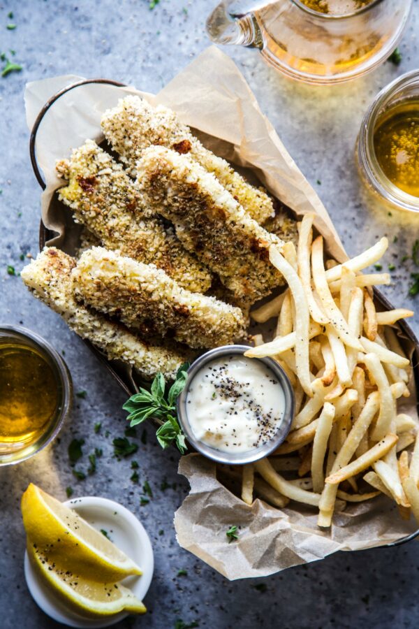 Baked Za'atar Fish Sticks and Chips on a table