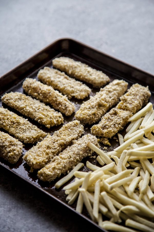 Baked Za'atar Fish Sticks and Chips on a sheet pan ready to baked