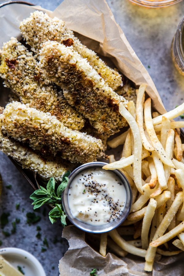 Baked Za'atar Fish Sticks and Chips on a table