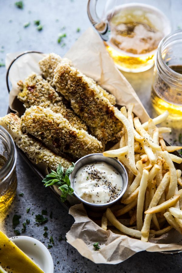 Baked Za'atar Fish Sticks and Chips on a table