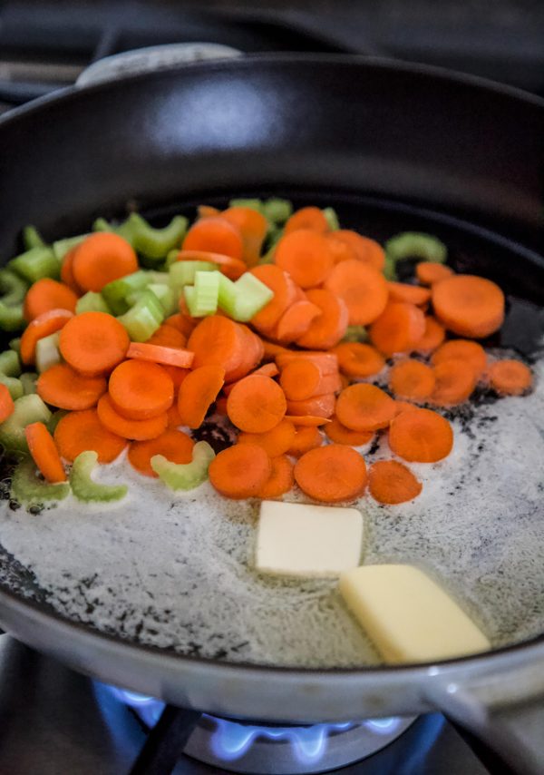 carrots and celery cooking a skillet with butter
