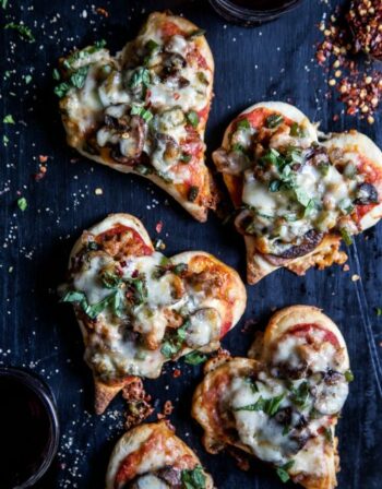 mini heart-shaped pizzas on a table