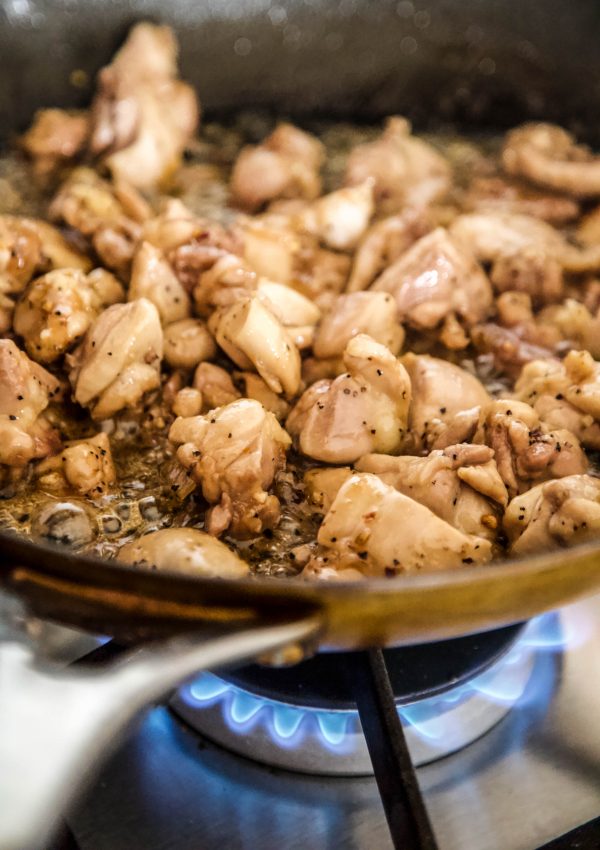 chicken cooking in a skillet