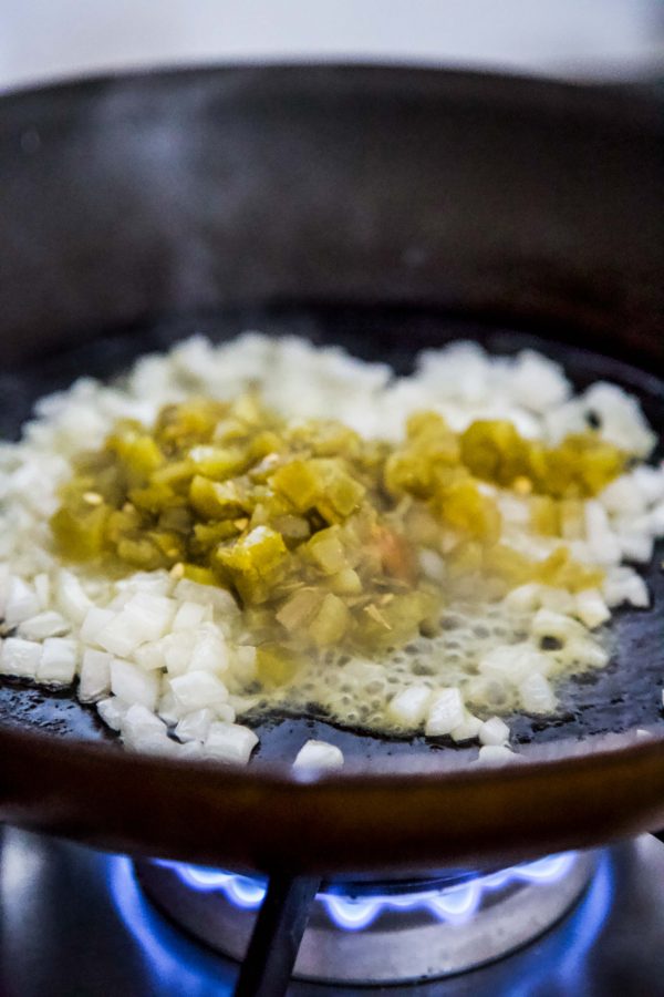 green chiles and onions in a skillet