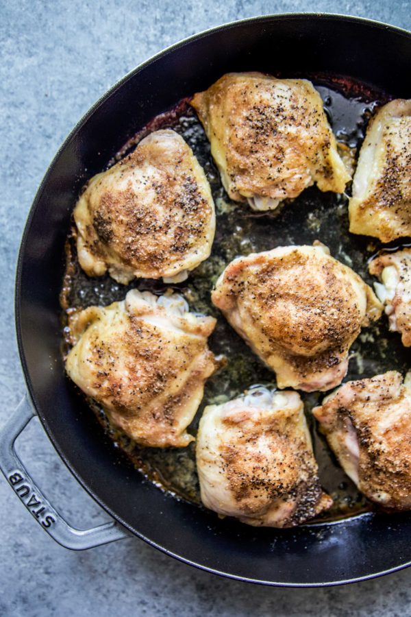 roasted chicken thighs in a skillet