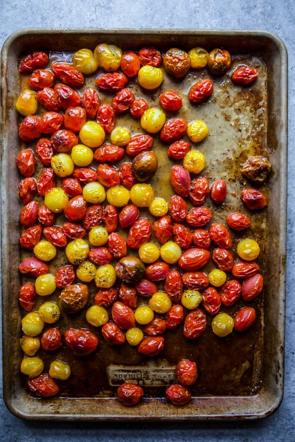 roasted grape tomatoes on a baking sheet