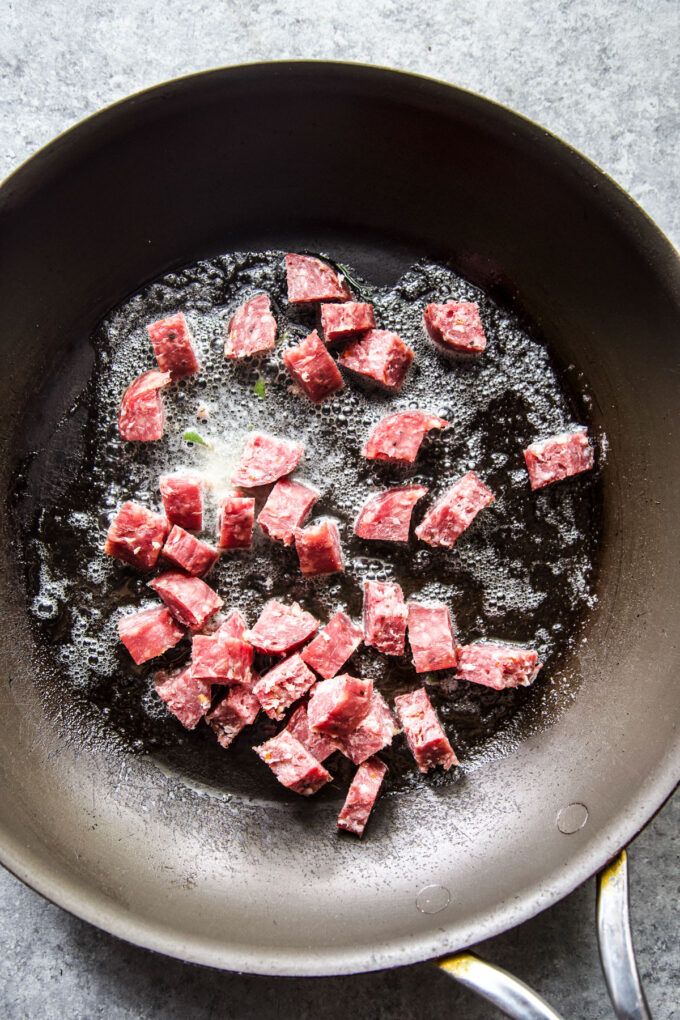 cooking salami in a skillet