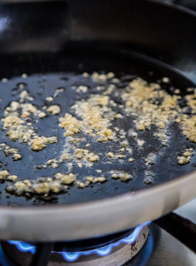 ginger and garlic cooking in a skillet