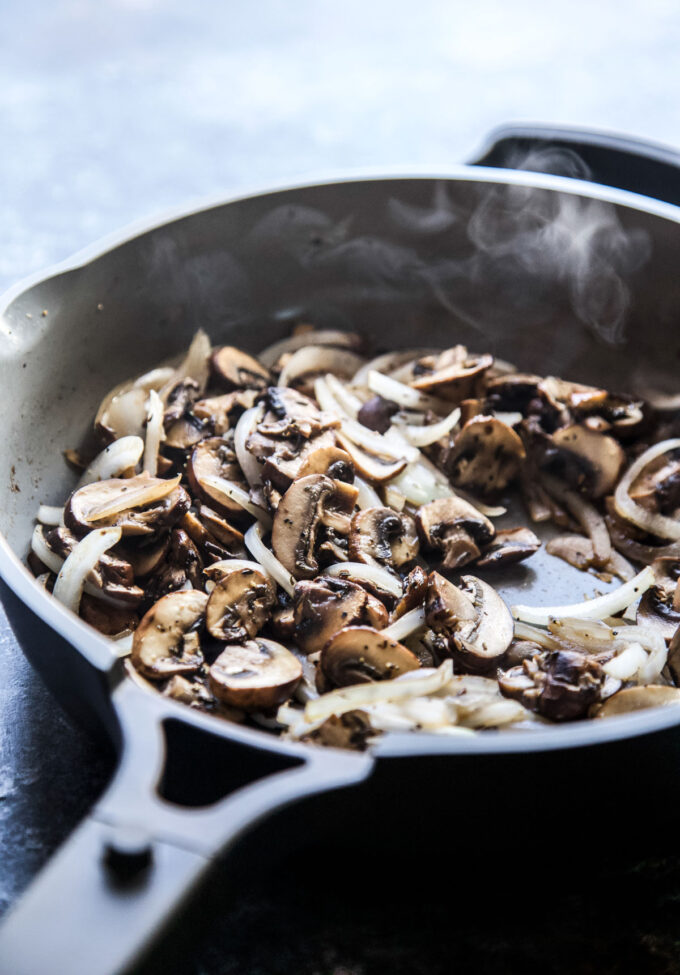mushrooms cooking in a skillet