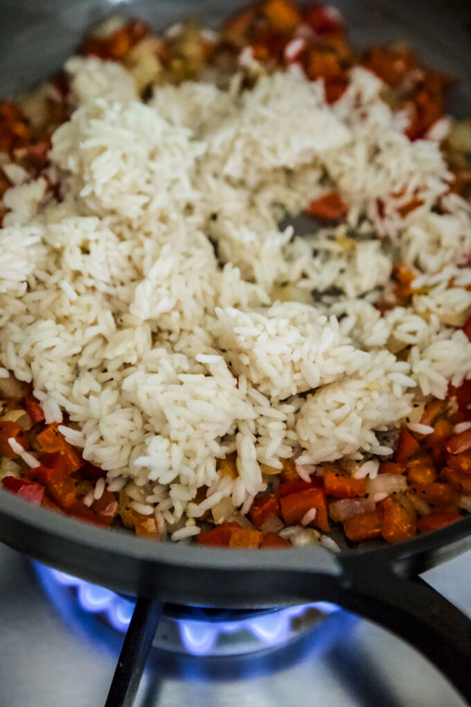 rice cooking in a skillet