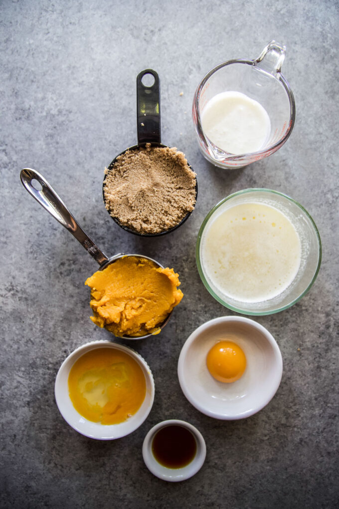 wet ingredients to make Baked Pumpkin Doughnuts with Maple Frosting www.thecuriousplate.com