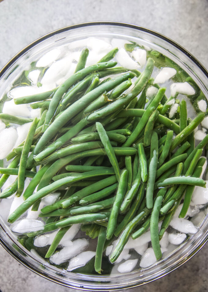 green beans being blanched in an ice bath