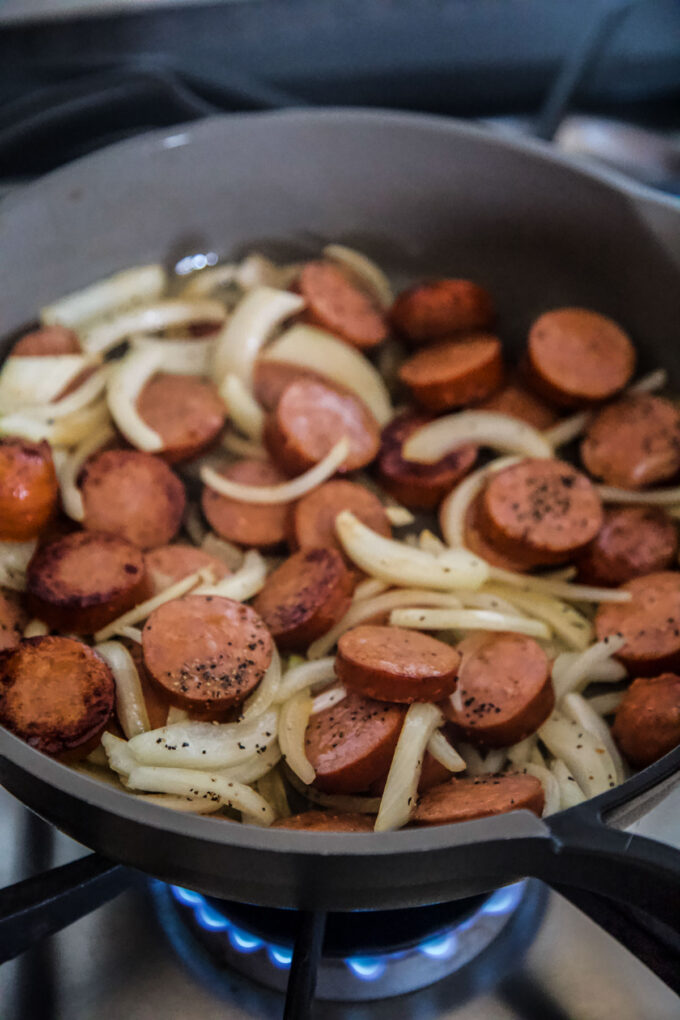 sausage and onions in a skillet