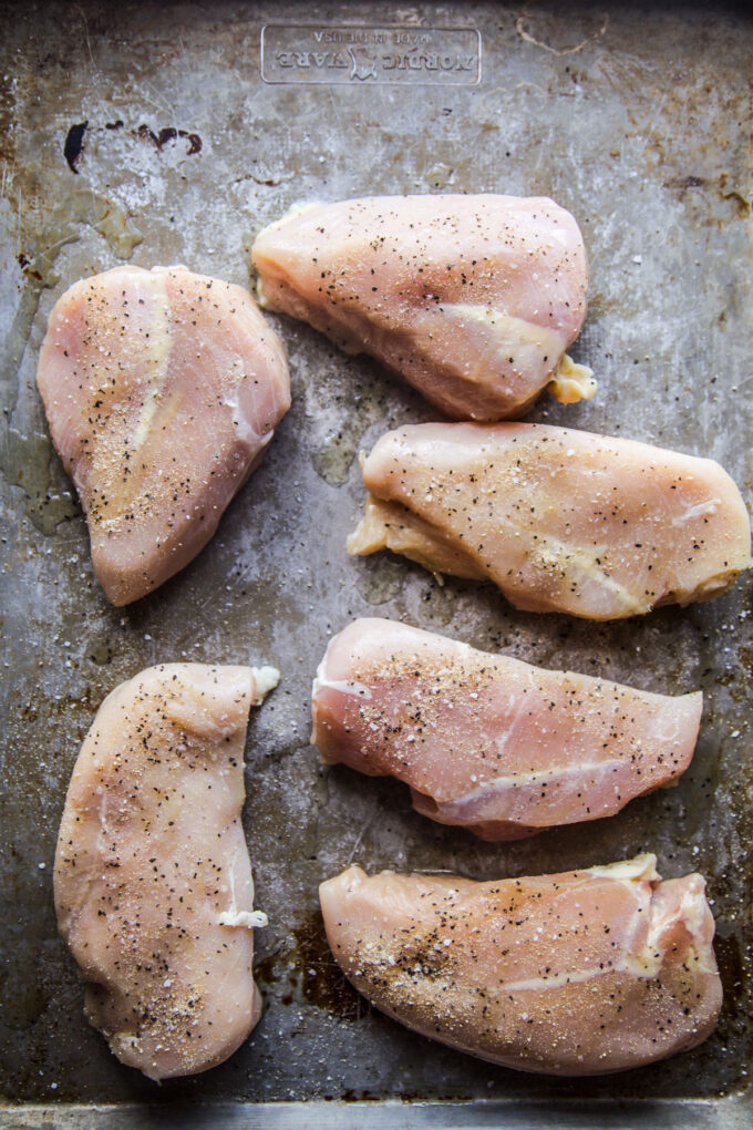 chicken breasts on a baking sheet