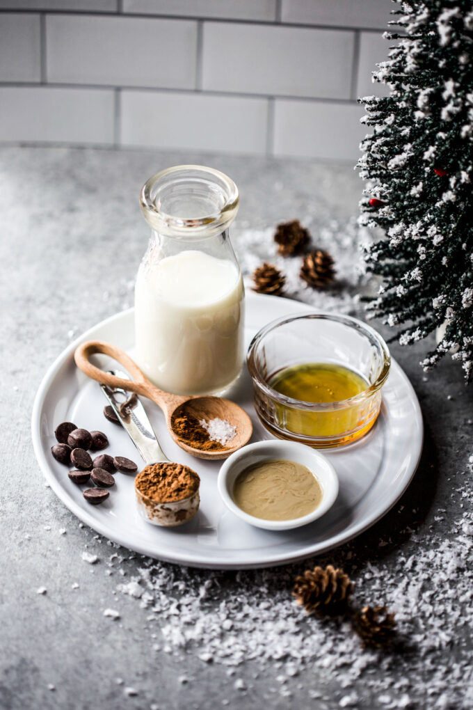 ingredients to make easy tahini hot chocolate on a plate