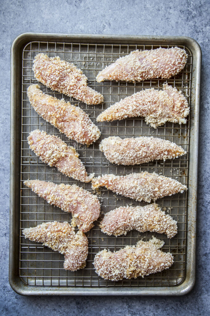 pre baked chicken tenders on a wire rack