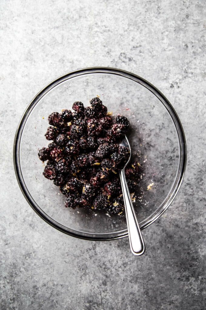 blackberries in a bowl with sugar