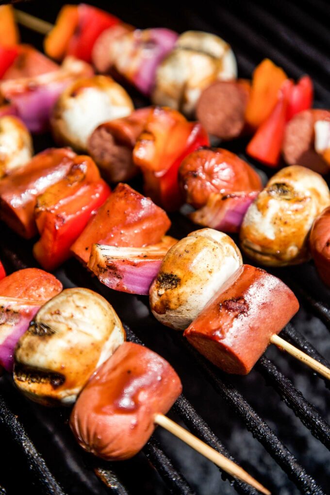 hot dog skewers being grilled