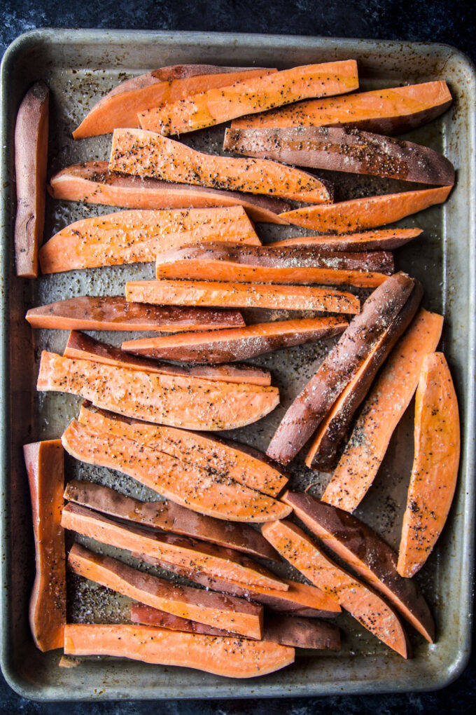 sweet potato wedges on a baking sheet