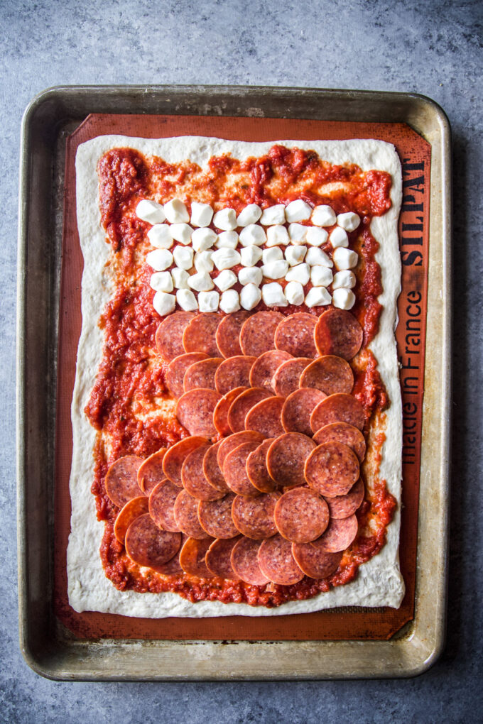 stocking shaped pizza before being cooked