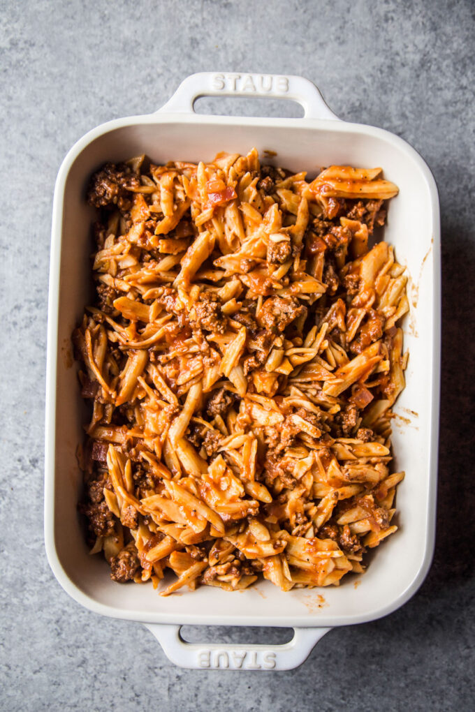 ziti lamb mixture in a dish 