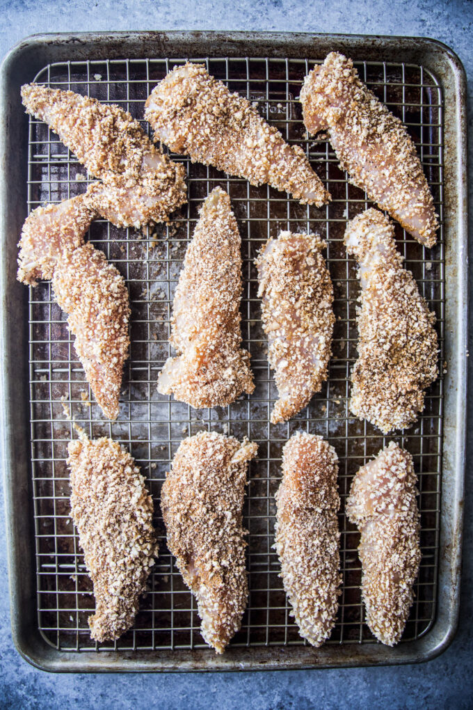 chicken tenders on a baking sheet