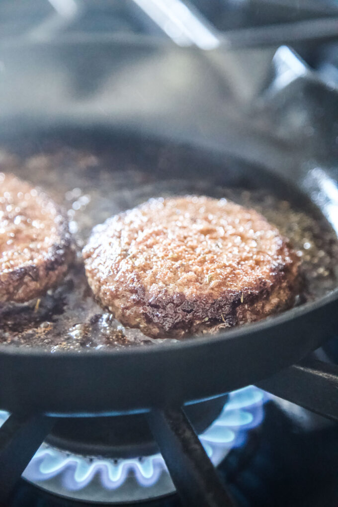 creole burgers in a skillet