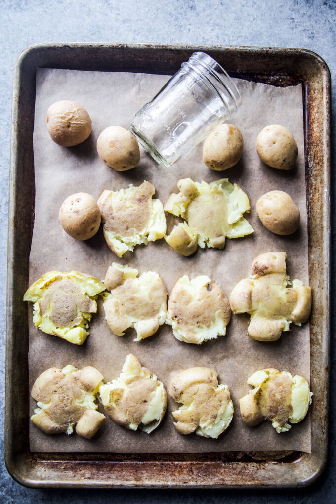 smashed potatoes on a baking sheet